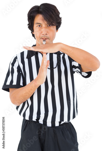 Referee showing timeout gesture while blowing whistle