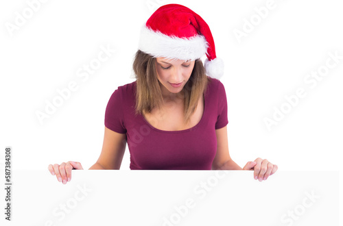 Festive cute brunette holding poster