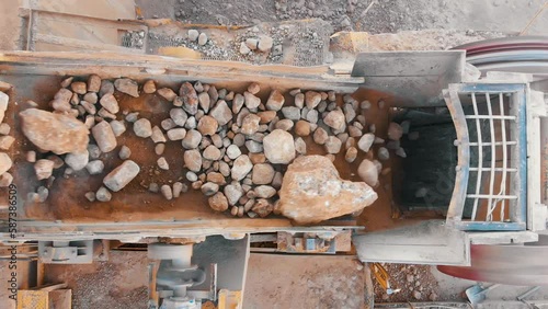 Stone jaw crusher plant. Sand and Stone Making Plant and Belt conveyor in mining quarry. Sand crushing and bulk materials for construction. Screening in open-pit mining. Stone crushing plant.