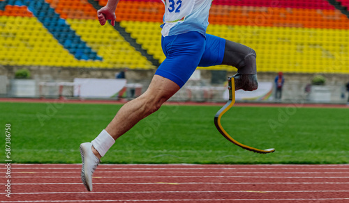 athlete runner sprinter on prosthesis running stadium track, disabled athlete para athletics competition, summer sports games