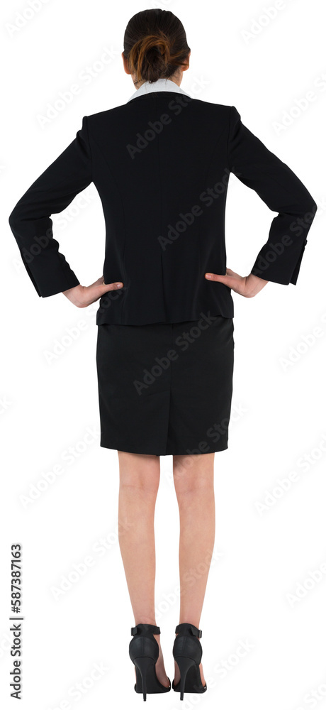 Young businesswoman standing with hands on hips