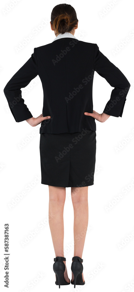 Young businesswoman standing with hands on hips Young businesswoman standing with hands on hips