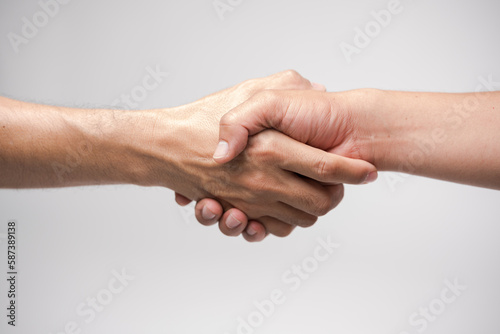 Close up two man shaking hand on white background.Athletes shaking hands before sports competition. Unity and teamwork concept.