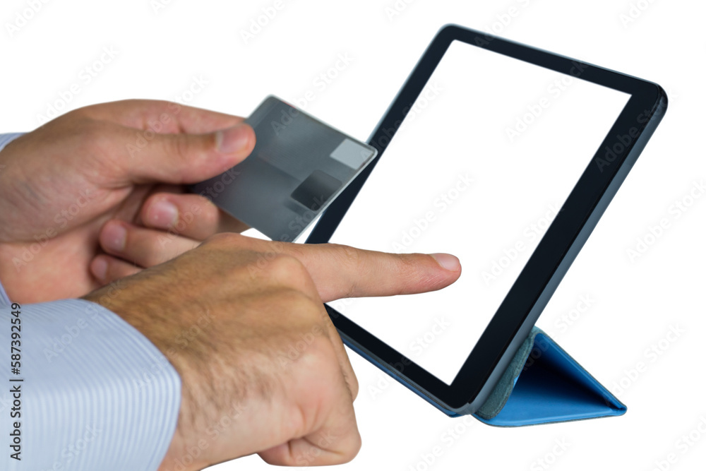 Businessman holding credit card and using digital tablet Businessman holding credit card and using digital tablet