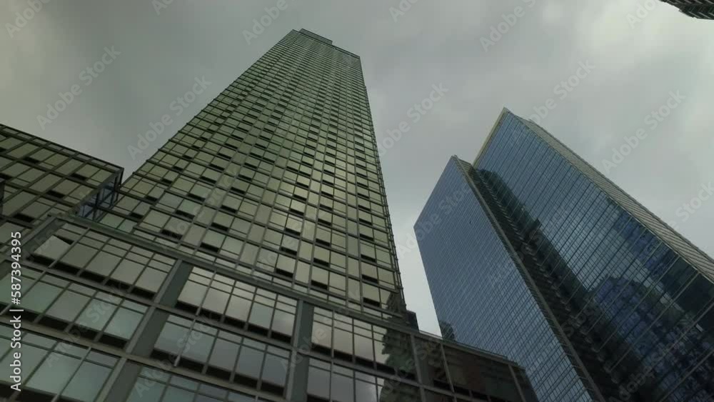 Pov Shot Of Office Buildings Against Sky In Financial District - New York City, New York Pov Shot Of Office Buildings Against Sky In Financial District - New York City, New York