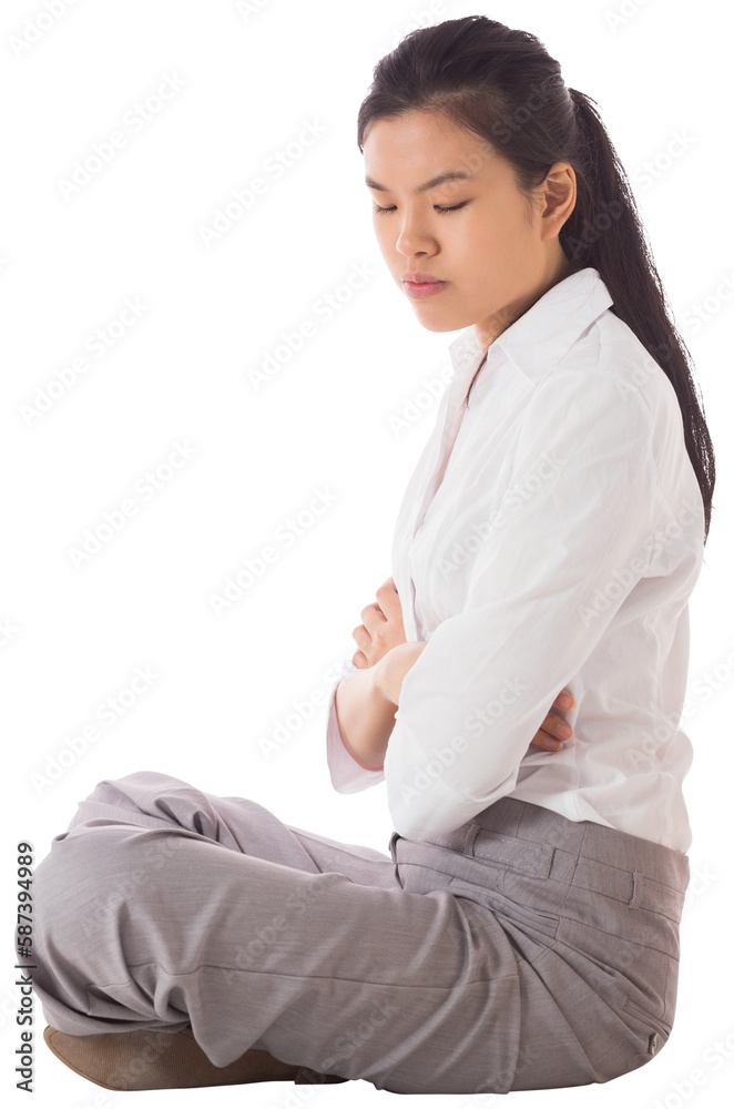 Businesswoman sitting cross legged with arms crossed Businesswoman sitting cross legged with arms crossed