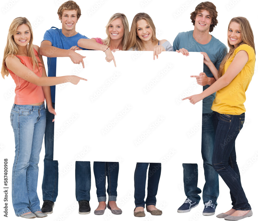 Obraz premium Smiling group of people with a blank space as they point to it