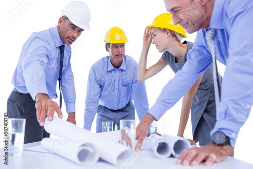 team of business people looking at construction plan 