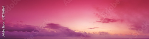 Cloudy sky at sunset. Magenta gradient color. Sky texture. Abstract nature background. Horizontal banner