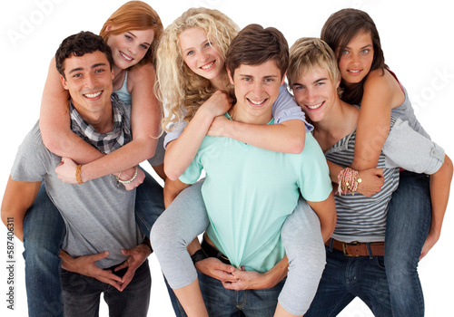 Teenagers giving their friends piggyback rides photo