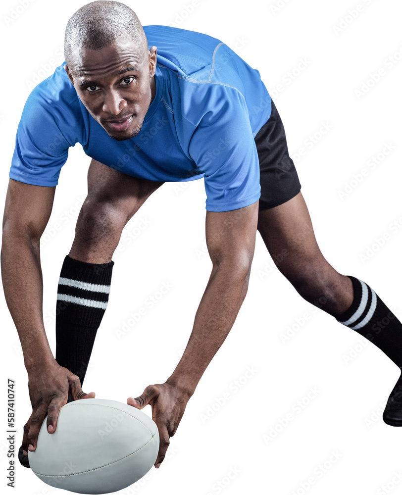 Portrait of sportsman bending and holding ball while playing rugby Portrait of sportsman bending and holding ball while playing rugby