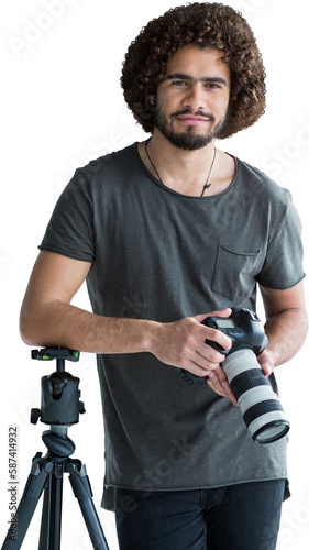 Portrait of young photographer holding digital camera photo