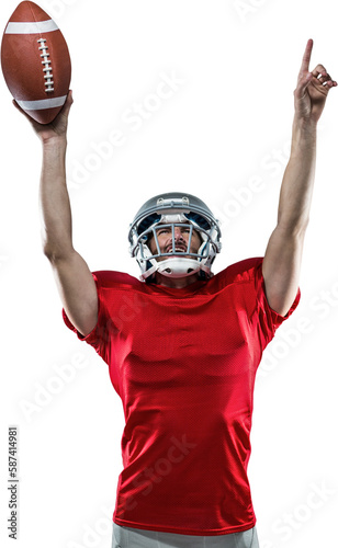 American football player with holding ball arms raised