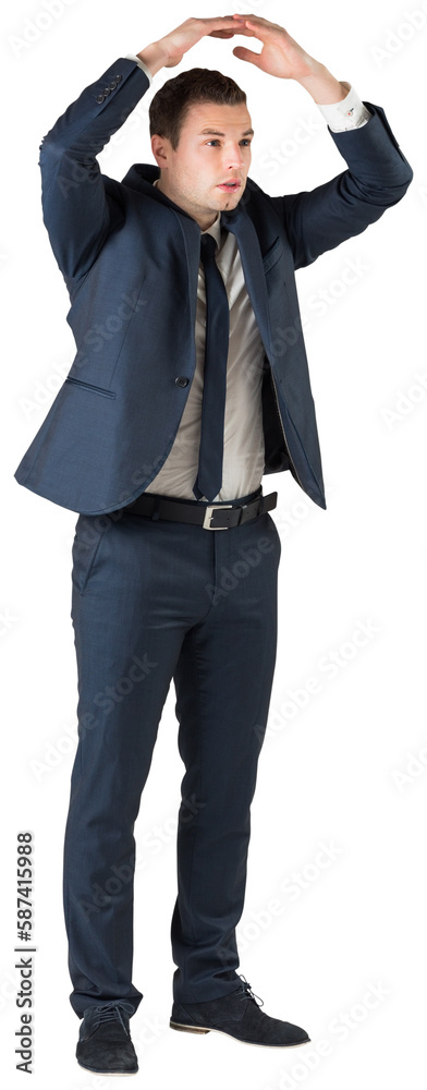 Businessman standing with hands over head