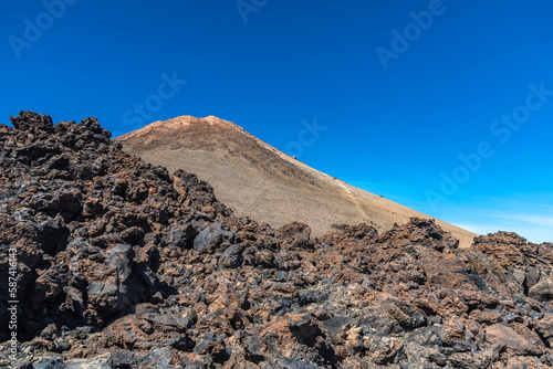 Peak of Teide Volcano and lava around on sunny March day