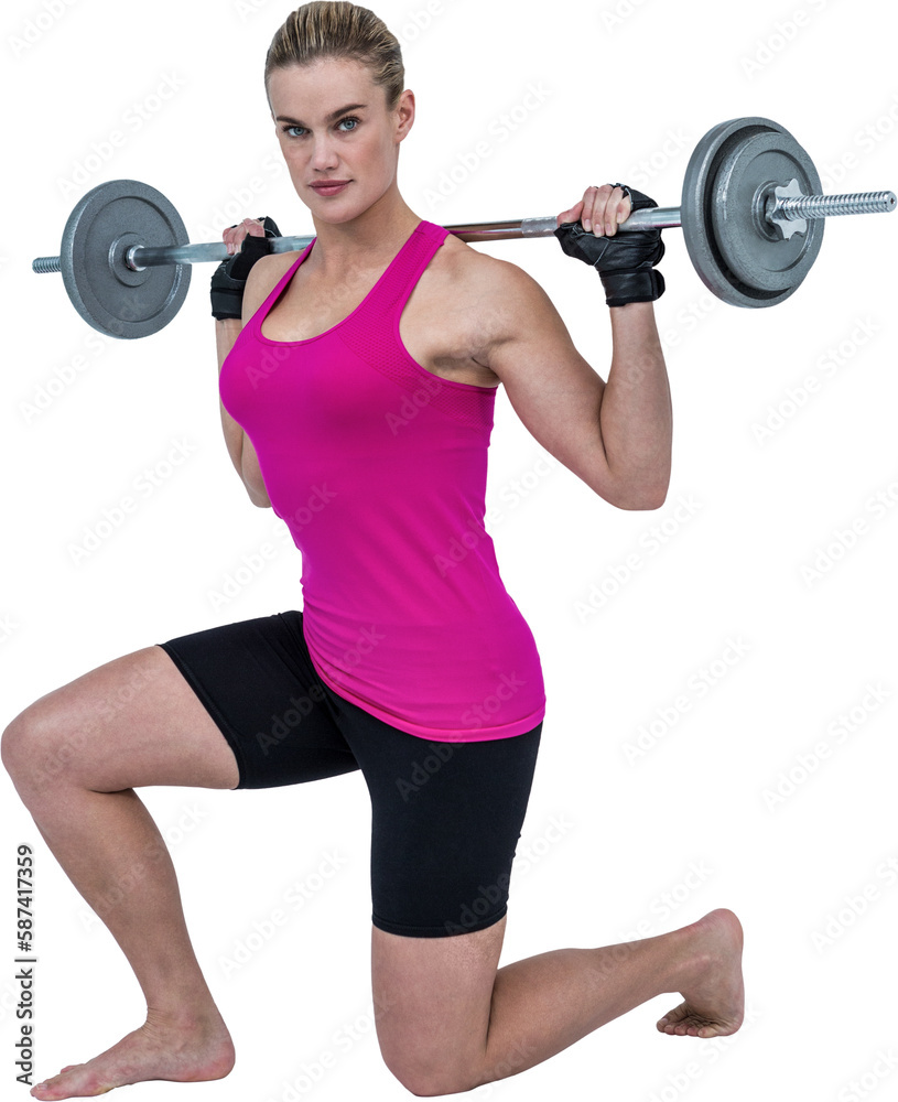 Obraz premium Sporty female bodybuilder lifting barebell