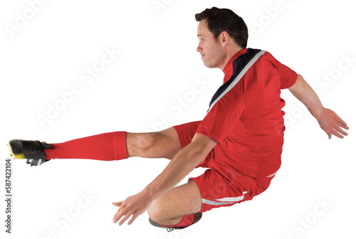 Football player in red kicking