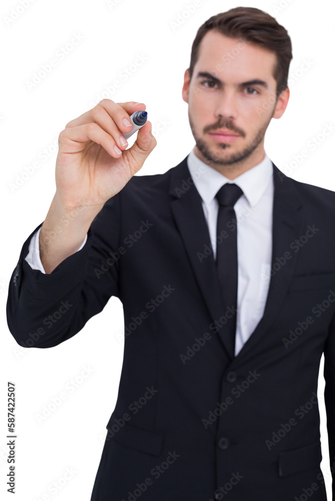 Serious businessman writing with marker Serious businessman writing with marker