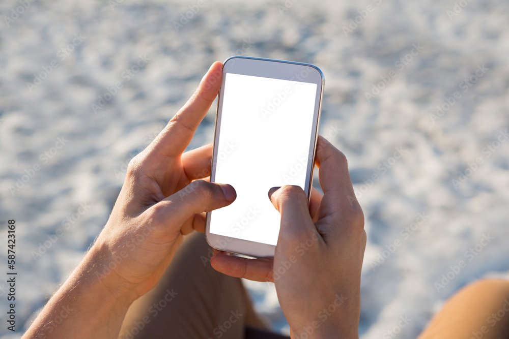hands of man using mobile phone at beach hands of man using mobile phone at beach