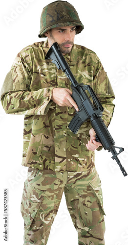 Soldier holding rifle while standing