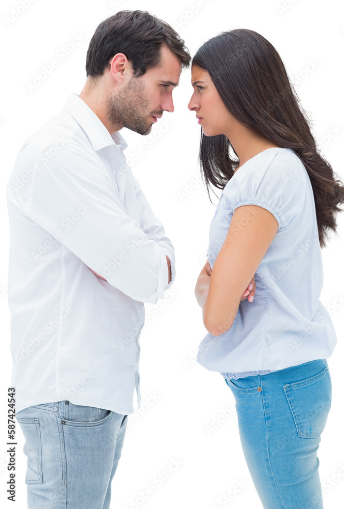 Angry couple facing off after argument Angry couple facing off after argument