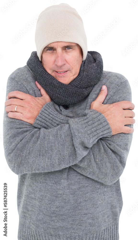 Casual man shivering in warm clothing Casual man shivering in warm clothing