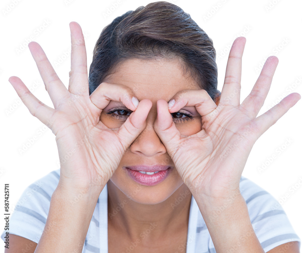 Close-up portrait of beautiful woman looking through fingers