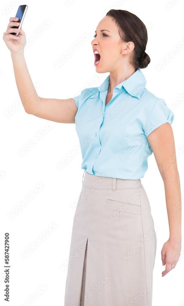 Angry classy businesswoman yelling at her smartphone Angry classy businesswoman yelling at her smartphone