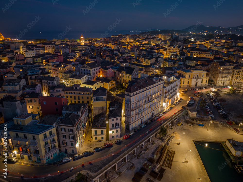 Aerial drone view of Corfu old town by night