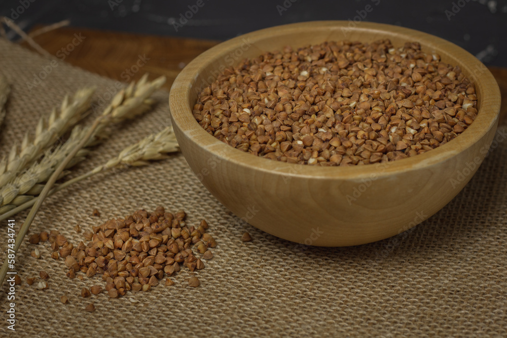 Buckwheat on a wooden board. Buckwheat on top. Buckwheat in a bowl. Cereals Buckwheat on a wooden board. Buckwheat on top. Buckwheat in a bowl. Cereals