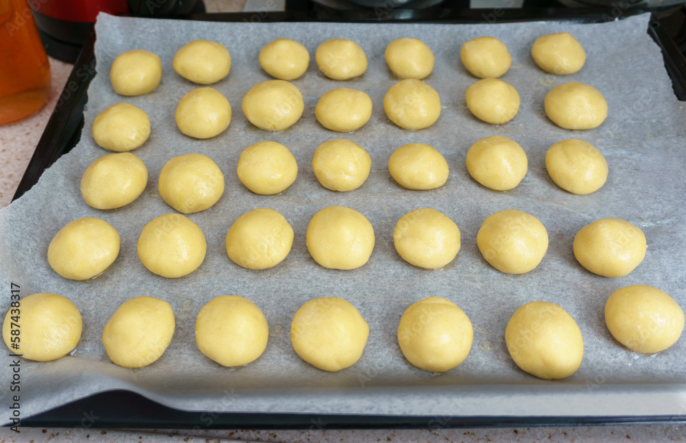 Uncooked cookies on tray top view. Uncooked cookies on tray top view.