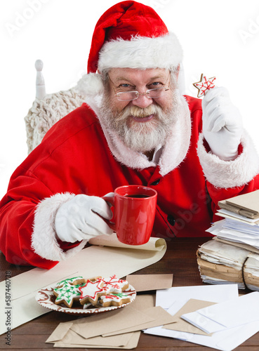 Portrait of cheerful Santa Claus holding coffee mug