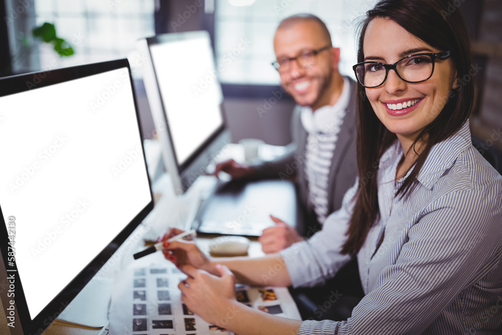 Businesspeople working on computer