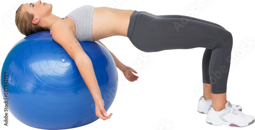 Fit young woman exercising with fitness ball