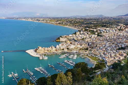 Top view of a beautiful landscape showing the city, port, sea, greenery in one shot.