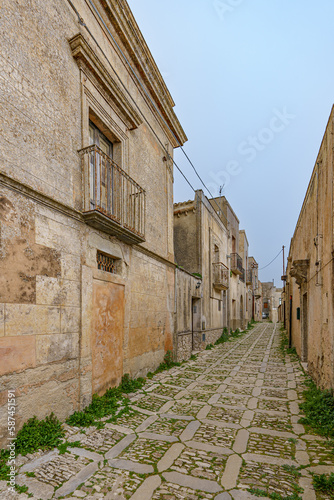 Fototapeta Naklejka Na Ścianę i Meble -  Very narrow atmospheric streets in an old small town with various hidden passages.