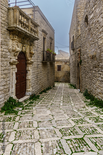 Fototapeta Naklejka Na Ścianę i Meble -  Very narrow atmospheric streets in an old small town with various hidden passages.