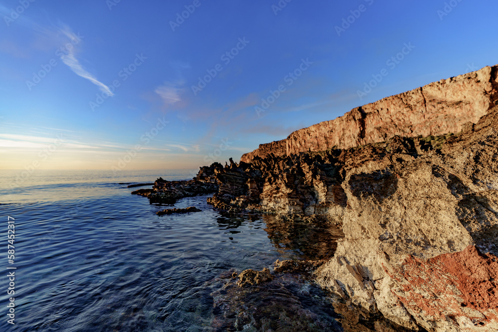 A beautiful shore, topped with sharp coastal rocks cutting the sea waves. A beautiful shore, topped with sharp coastal rocks cutting the sea waves.
