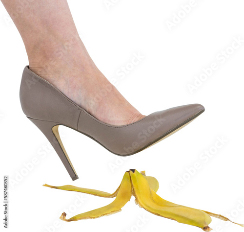 Businesswoman leg over banana peel