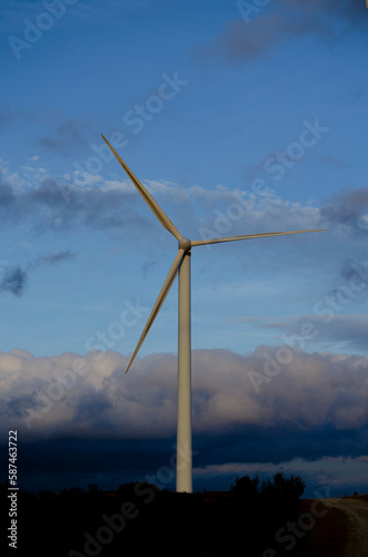 view of a stand-alone wind generator at sunset