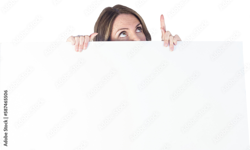Businesswoman hiding behind blank sign while pointing upward