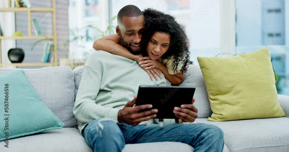 Couple, tablet and laughing with hug on sofa in home at comedy, joke or funny online meme. Interracial, touchscreen and happiness of black man and woman bonding on couch in lounge on social media. Couple, tablet and laughing with hug on sofa in home at comedy, joke or funny online meme. Interracial, touchscreen and happiness of black man and woman bonding on couch in lounge on social media.