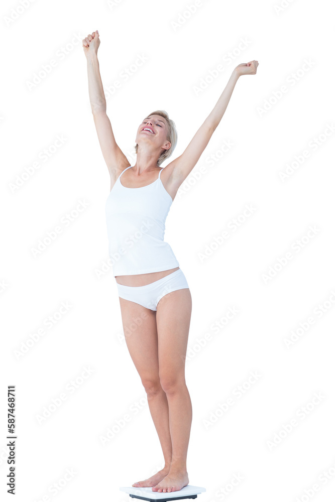 Happy woman standing on a scales spreading her arms Happy woman standing on a scales spreading her arms