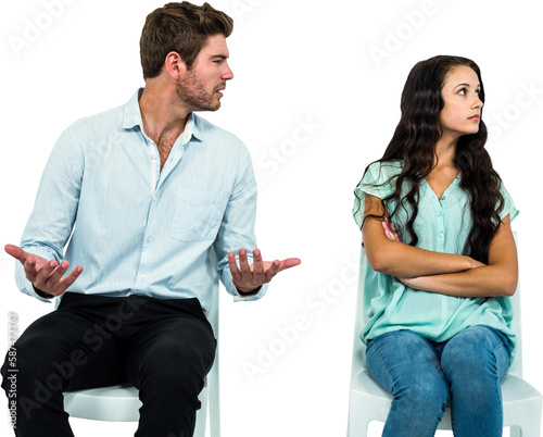 Obraz na płótnie Couple sitting on chairs having argument