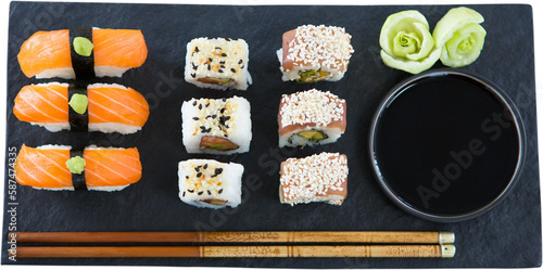 Sushi with salmon served in plate against white background