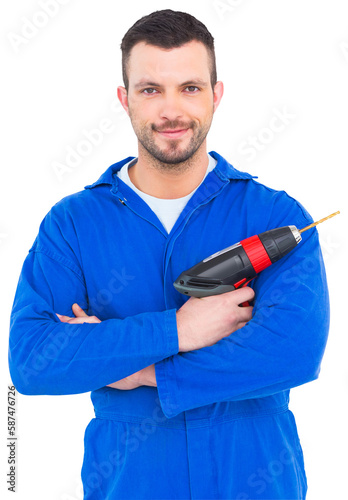 Confident handyman holding power drill