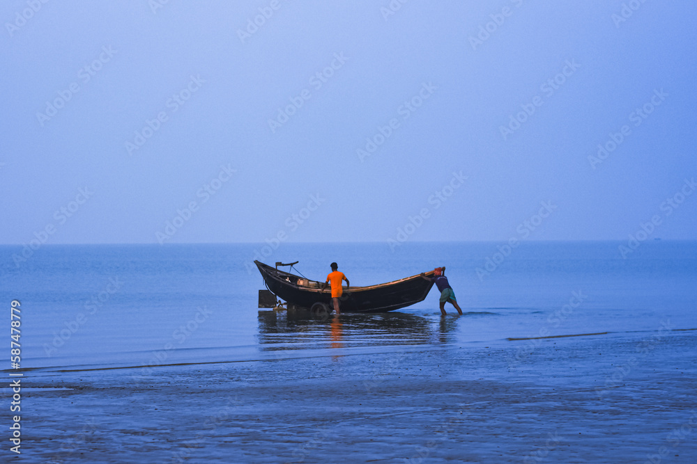 The fishing boat on beach at Cox’s Bazar preparing to it's journey