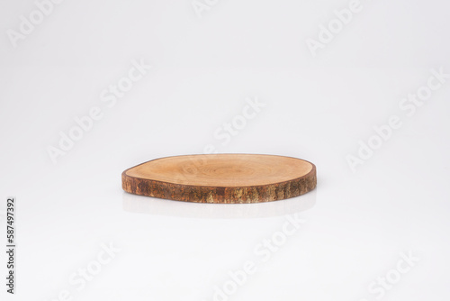 single natural wooden coaster isolated on white background. handmade. wooden display.