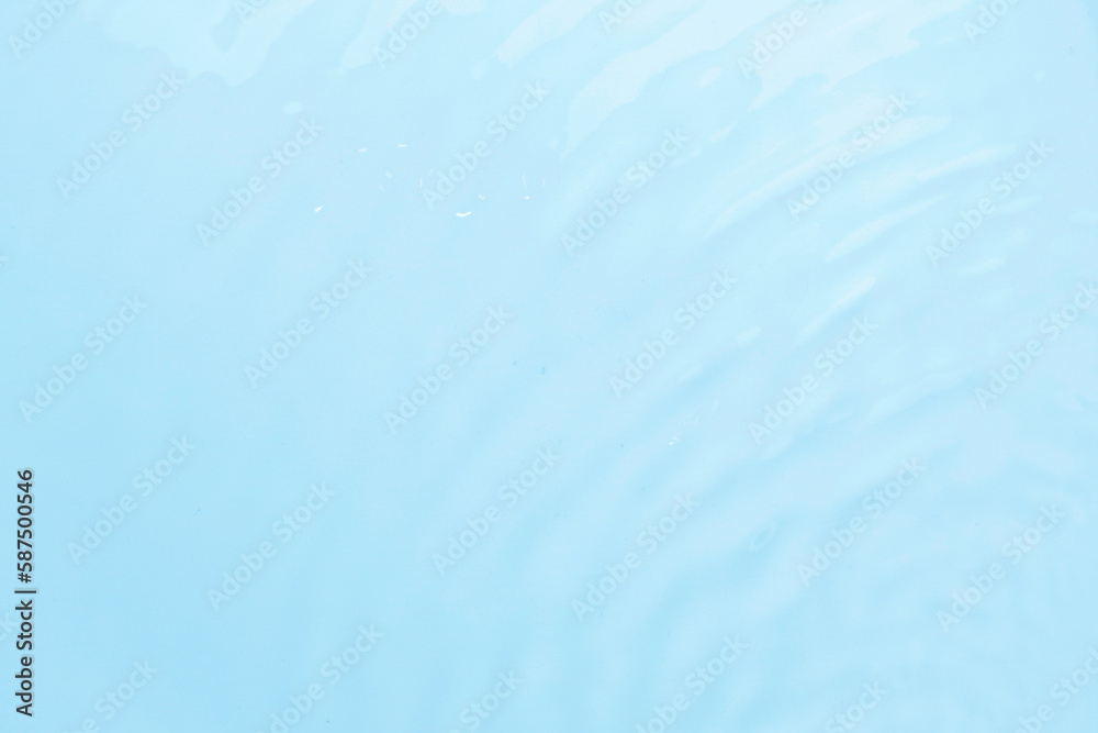 Waves on the surface of the water. gentle light waves, water, top view. Cyan, blue, transparent