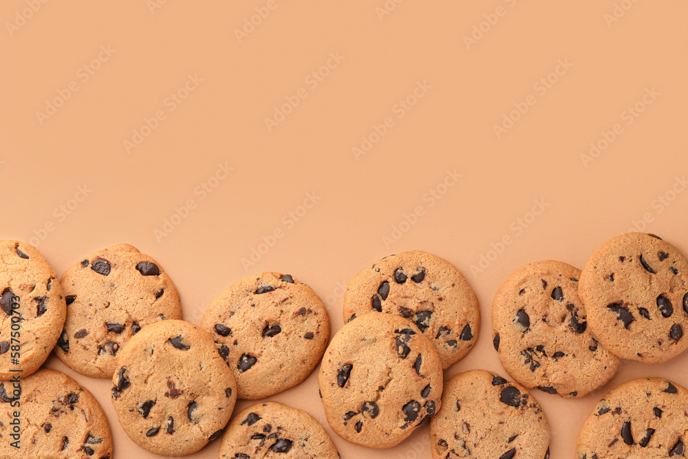Many delicious chocolate chip cookies on beige background, flat lay. Space for text Many delicious chocolate chip cookies on beige background, flat lay. Space for text
